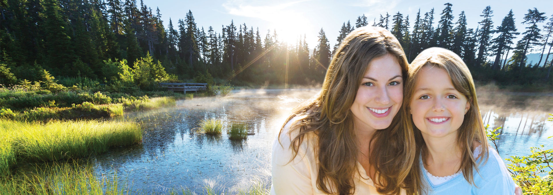 Mother and daughter by a pond.